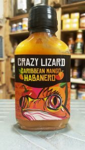 Botella de salsa picante crazy lizard caribbean mango habanero en la tienda de especias Sally Pepper Spices