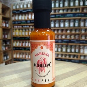 Botella de cristal de salsa picante Achilipú Harissa de 125ml.